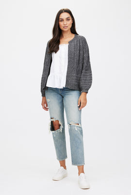 Cardigan en tricot torsadé ouvert à l'avant
